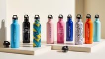 Personalized water bottles or travel mugs as closing gifts for new home buyers 